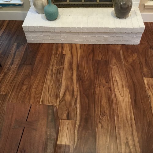 fireplace with hardwood floor Peoples Signature Flooring Austin Texas, 7.5 Inch Wide Hand Sculpted Acacia Natural 1x8 Baseboards