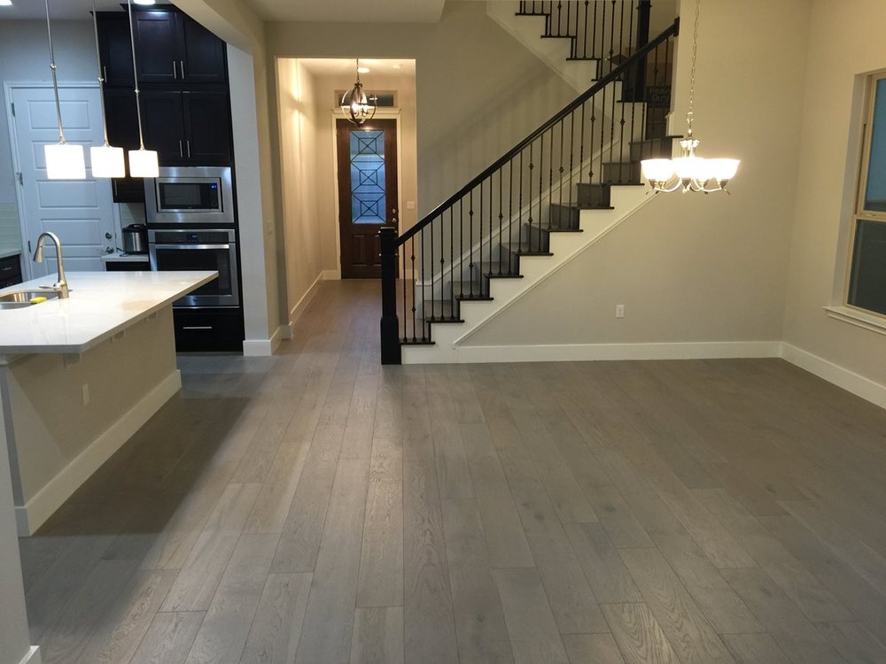 living room/dining room with hardwood floor Peoples Signature Flooring Austin Texas